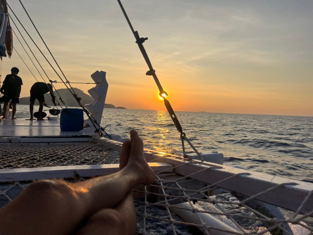 sunset from boat in labuan bago